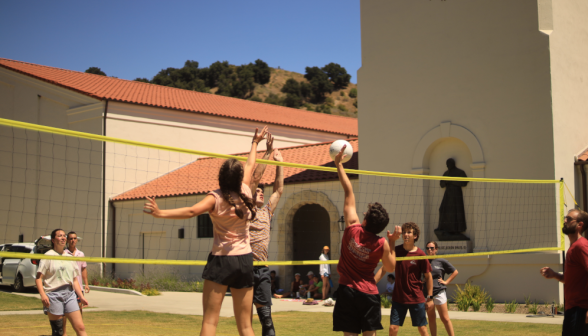 Students play volleyball