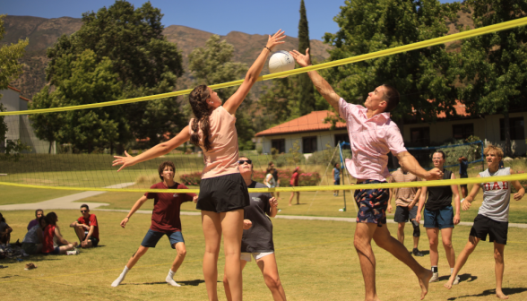 Students play volleyball