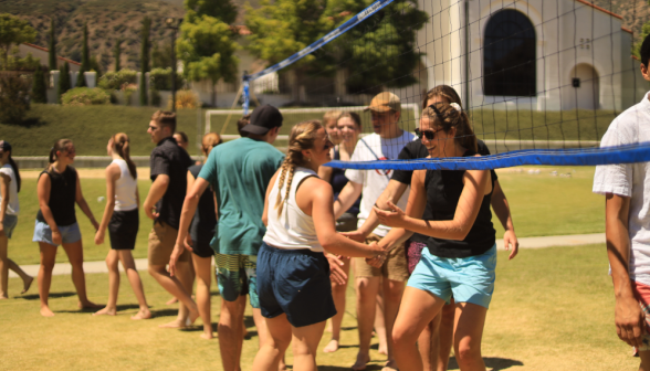 Students play volleyball