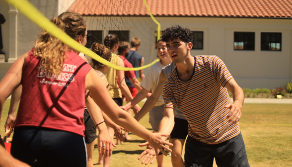 Students play volleyball