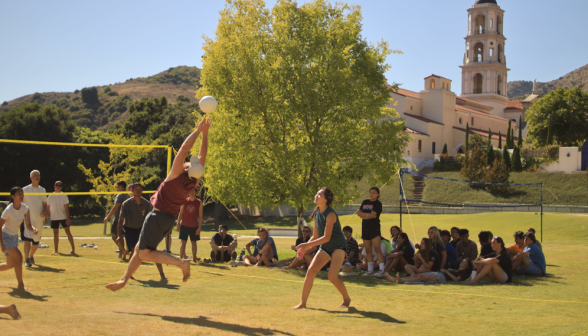 Students play volleyball