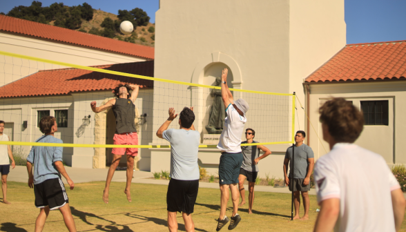 Students play volleyball