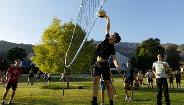 Students play volleyball