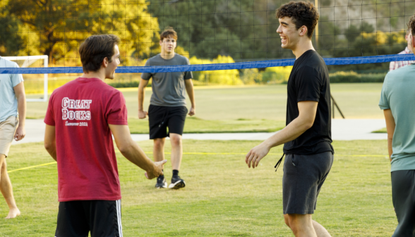 Students play volleyball
