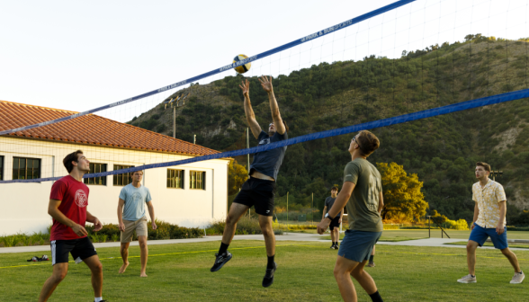Students play volleyball