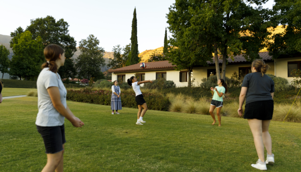Students play volleyball