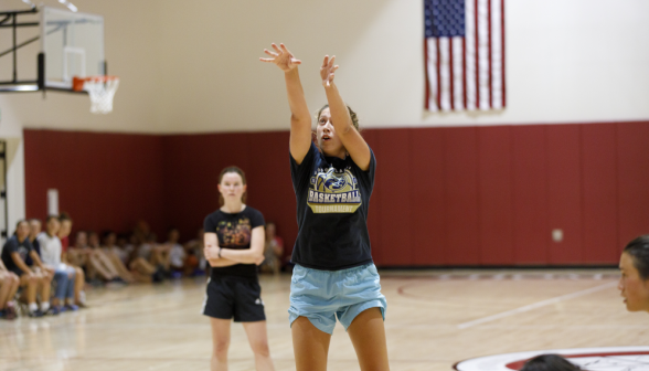 Students play basketball