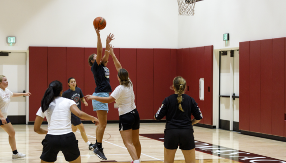 Students play basketball