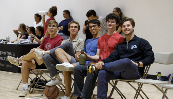 Students play basketball