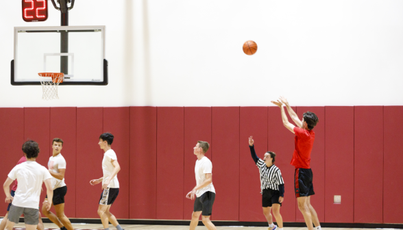 Students play basketball