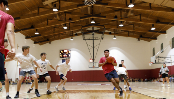 Students play basketball