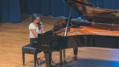 A student plays the piano