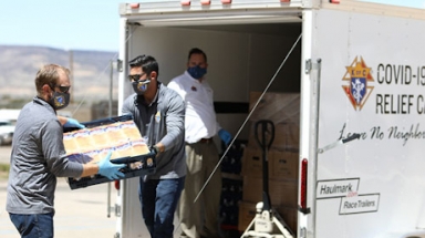 Knights of Columbus load a truck with supplies