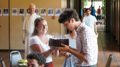 Josh blows out candles on birthday cake