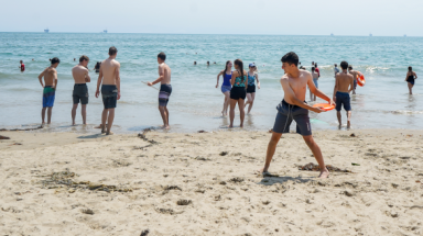 Winding up for a frisbee throw at the beach