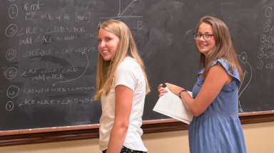 Students at blackboard