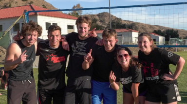 Students play volleyball