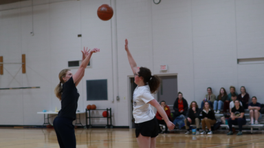 Students play basketball