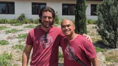 Two Summer Program prefects pose in front of one of the dorms