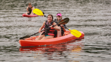 Two in a kayak out on the river