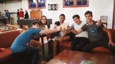 Students clink their root beer floats