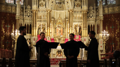 The Floriani sing afront a beautiful reredos