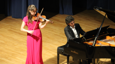 The Macknickas siblings perform on violin and piano