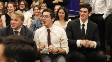 An excited team, seated