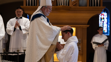 The Bishop performs the rite of ordination