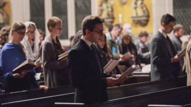 Students in the congregation sing