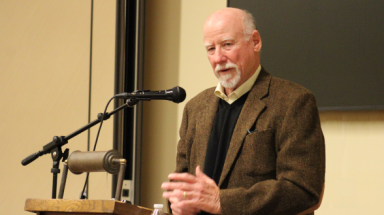 Dr. Krause speaks at the podium