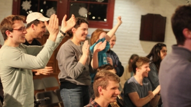 A student team applauds at Trivial Quadrivial Pursuit