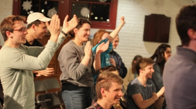 A student team applauds at Trivial Quadrivial Pursuit