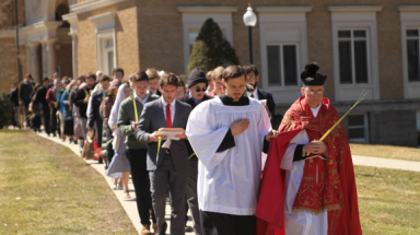 Fr. Markey, the altar servers, and the congregation process in New England
