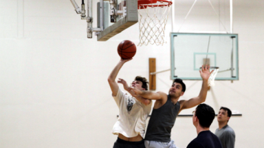 Students play basketball