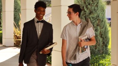 Students walk along the academic quadrangle