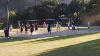 Students play volleyball