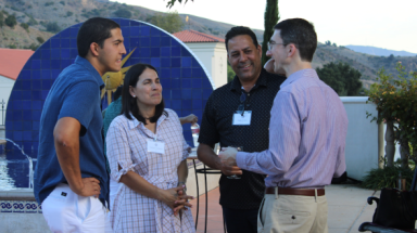 Parents talk with tutor Peter Knuffke