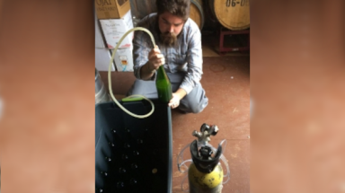 Dominic O’Reilly (’12) bottles a batch of Anna's Cider
