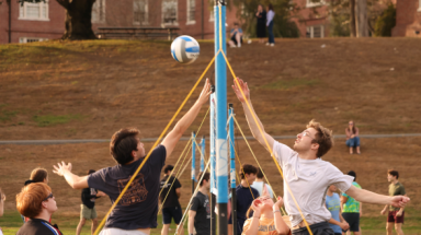 Students play volleyball