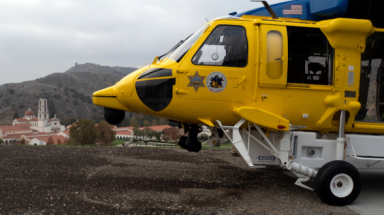 Firehawk helicopter with TAC Chapel in background