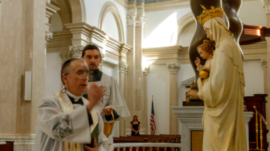 Fr. Marczewski blesses statue of Our Lady