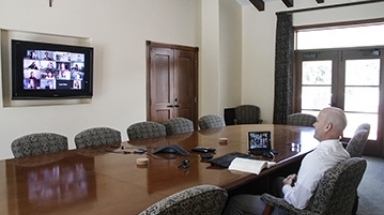 Tutor Brian Dragoo leads a class from the St. Thomas Hall co