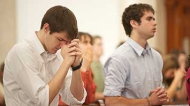 Students praying in Chapel