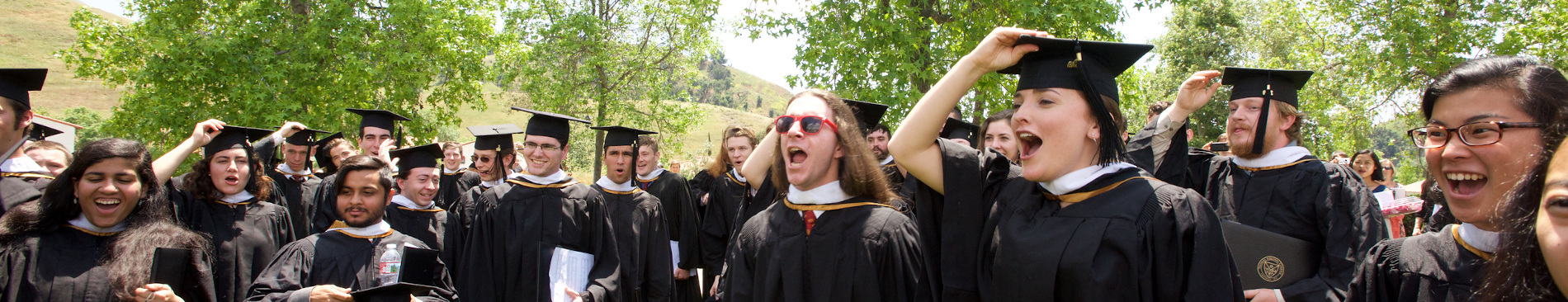 Students prepare to toss their mortarboards at Commencement
