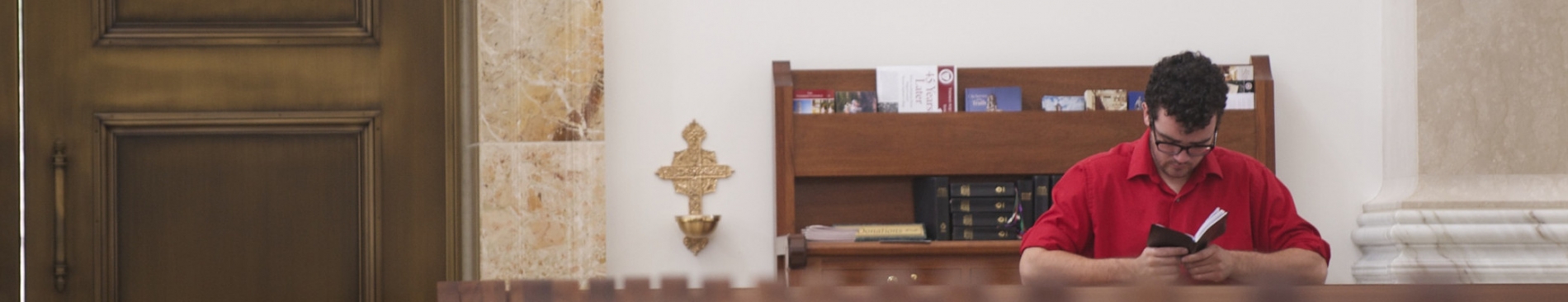 A student praying in Our Lady of the Most Holy Trinity Chapel