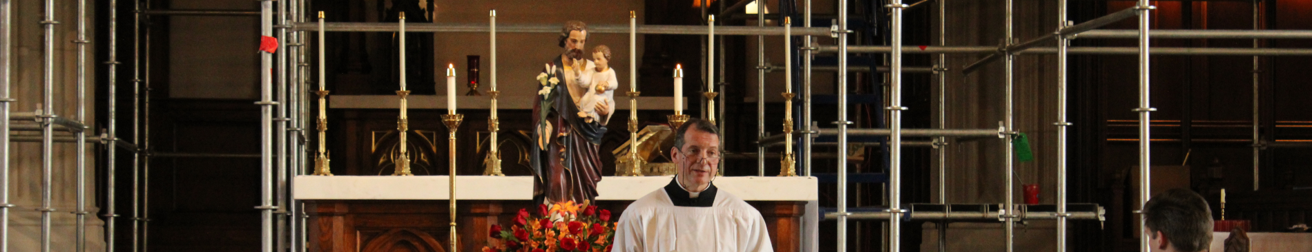 Fr. Markey with statue of St. Joseph