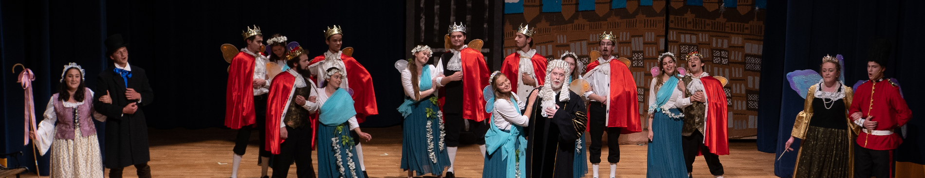 The Peers, their fairies, Will, the Queen, the Chancellor, and Strephano and Phyllis in the finale scene of the play