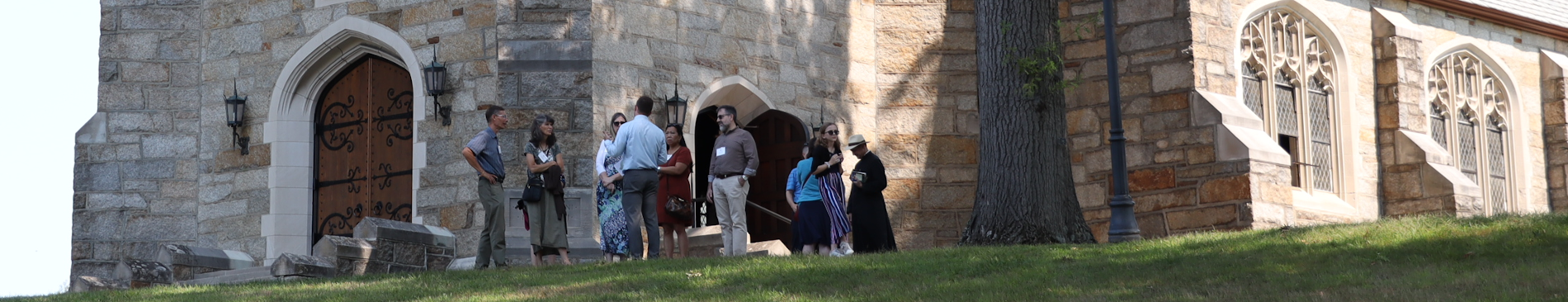 Alumni gather in front of Our Mother of Perpeutal Help Chapel