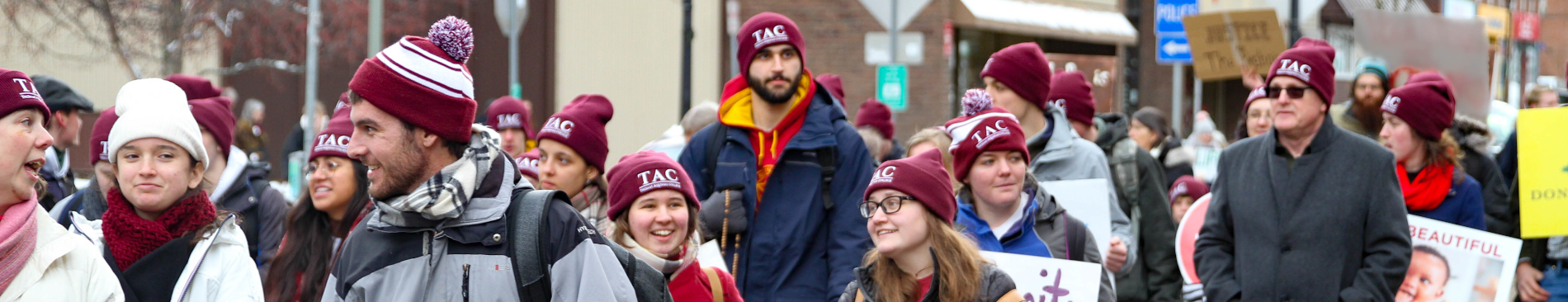 Students march in their TAC hats